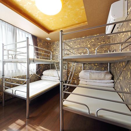 Guesthouse Tiga Кумамото Номер фото