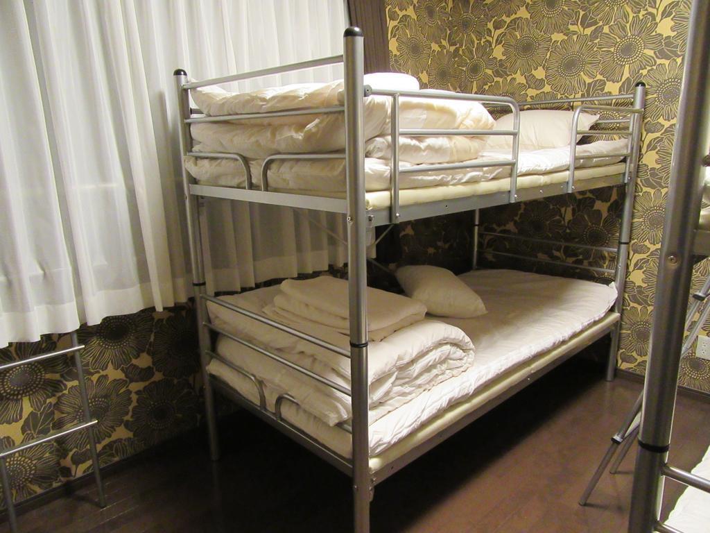 Guesthouse Tiga Кумамото Номер фото