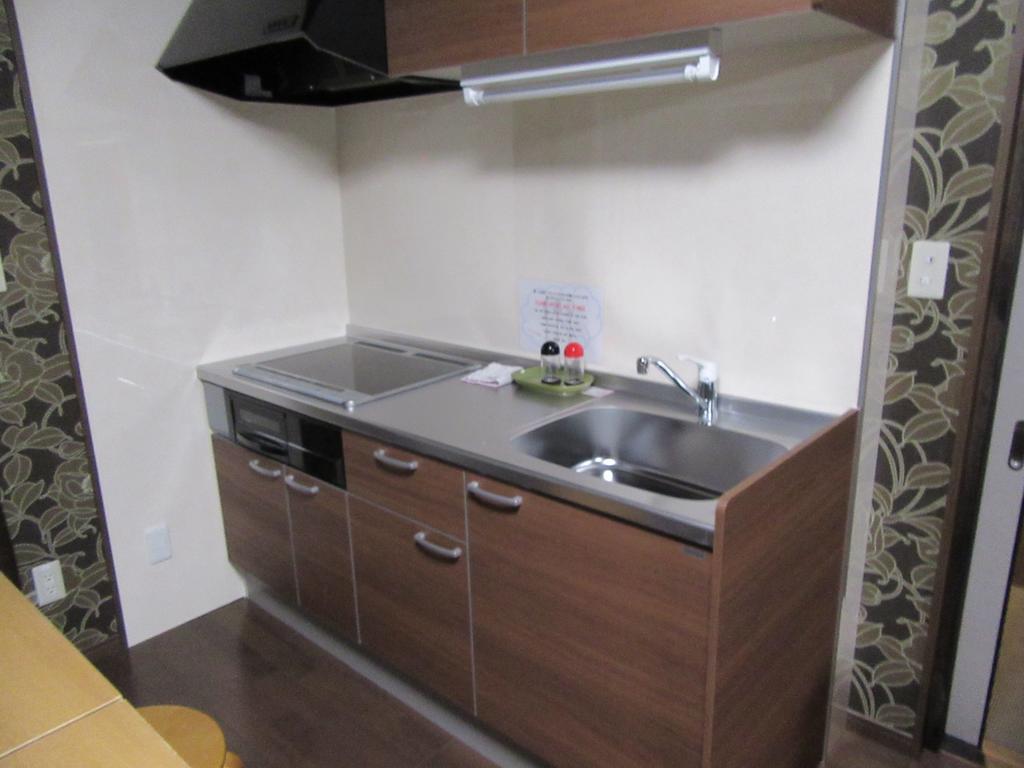 Guesthouse Tiga Кумамото Номер фото