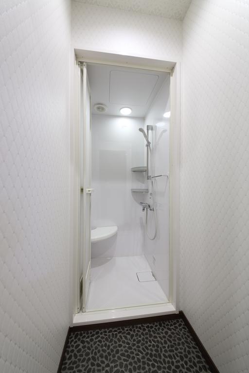 Guesthouse Tiga Кумамото Номер фото
